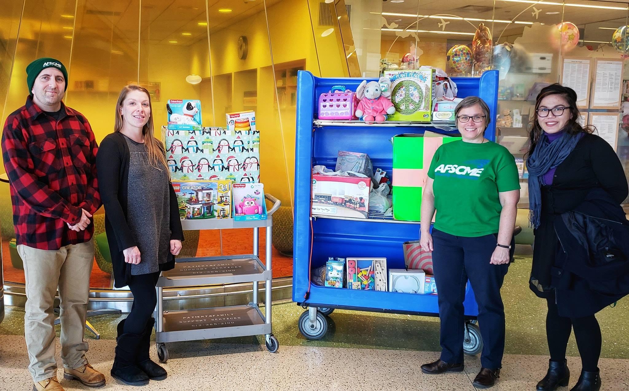 Local 3800 members Brad Sigal, Janaya Martin, Cherrene Horazuk and Marie Dino show off the toys they collected for the U of M’s Masonic Children’s Hospital